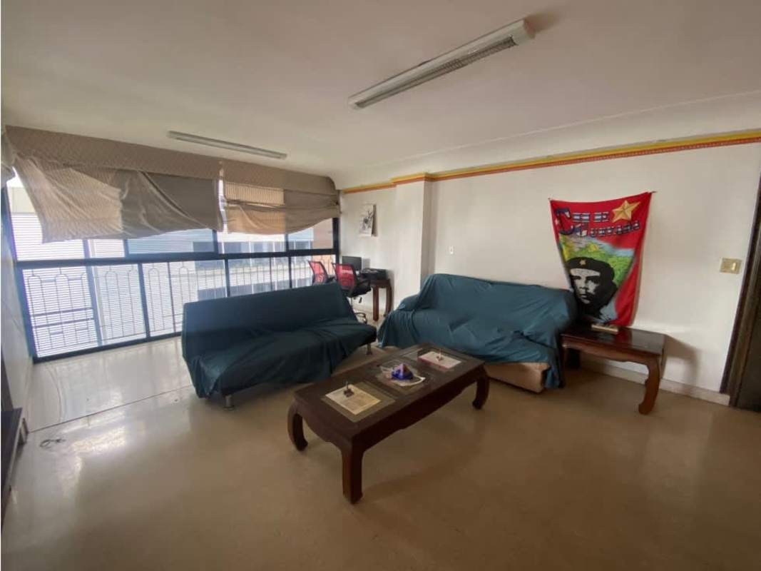 Bright dining room with wooden furniture, large windows, city view in El Cangrejo Panama