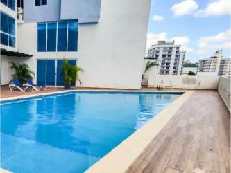 Outdoor pool deck with sun loungers at PH Coral Towers Carrasquilla Panama City