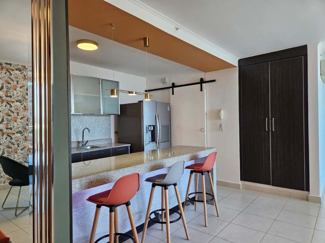 Bright hallway with white walls and tile floor at PH Midtown El Cangrejo Panama