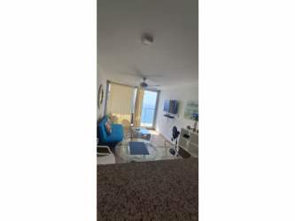 Bright bedroom with ceiling fan, AC, balcony access and ocean views in PH El Palmar beachfront condo Panama