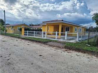 Open concept kitchen with tile backsplash in new beach house Santa Clara Panama