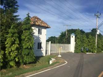 Mediterranean style gated entrance with security booth in Sol y Mar Playa Blanca Panama