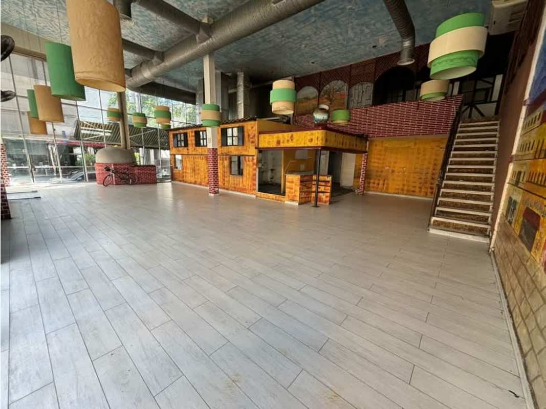 View of the interior mezzanine area with rustic brick details and large windows Downtown Plaza El Cangrejo