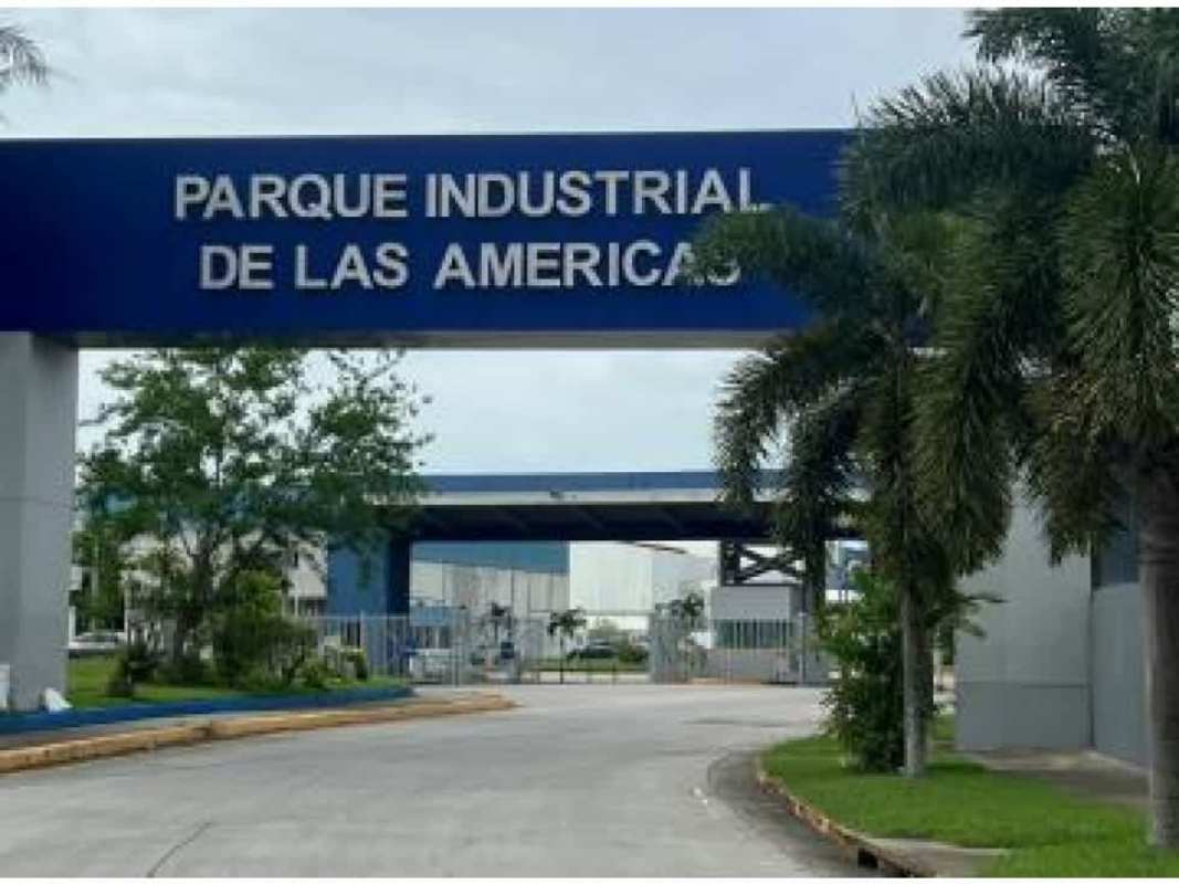 Main entrance security gate with signage and palm trees at Parque Industrial de Las Americas Tocumen Panama