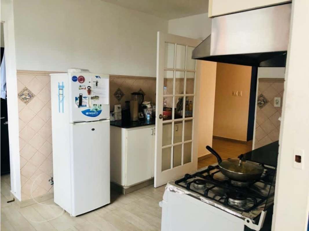 Kitchen equipped with stove, oven, refrigerator in PH Country Park San Francisco Panama City