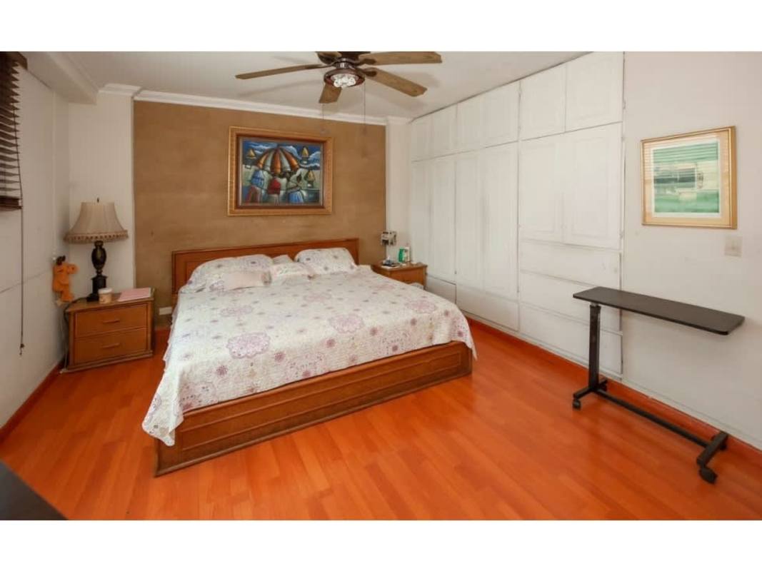 Spacious bedroom with large closet and wood flooring PH Majurova Panama City