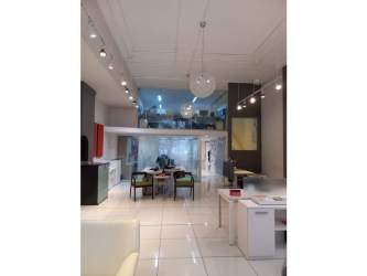 Contemporary open plan office and showroom interior with mezzanine and tile floors for lease Obarrio Panama City