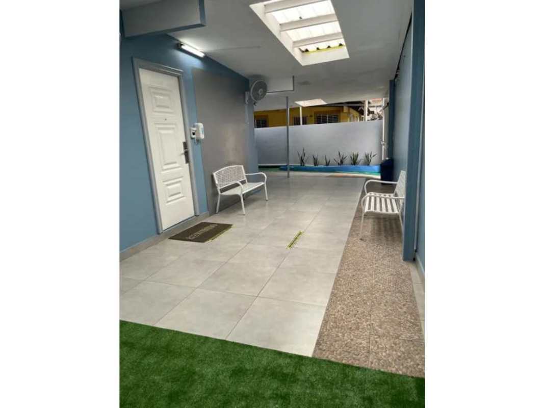 Corridor exterior covered with skylights planter beds office spaces Villa Cáceres Panama City