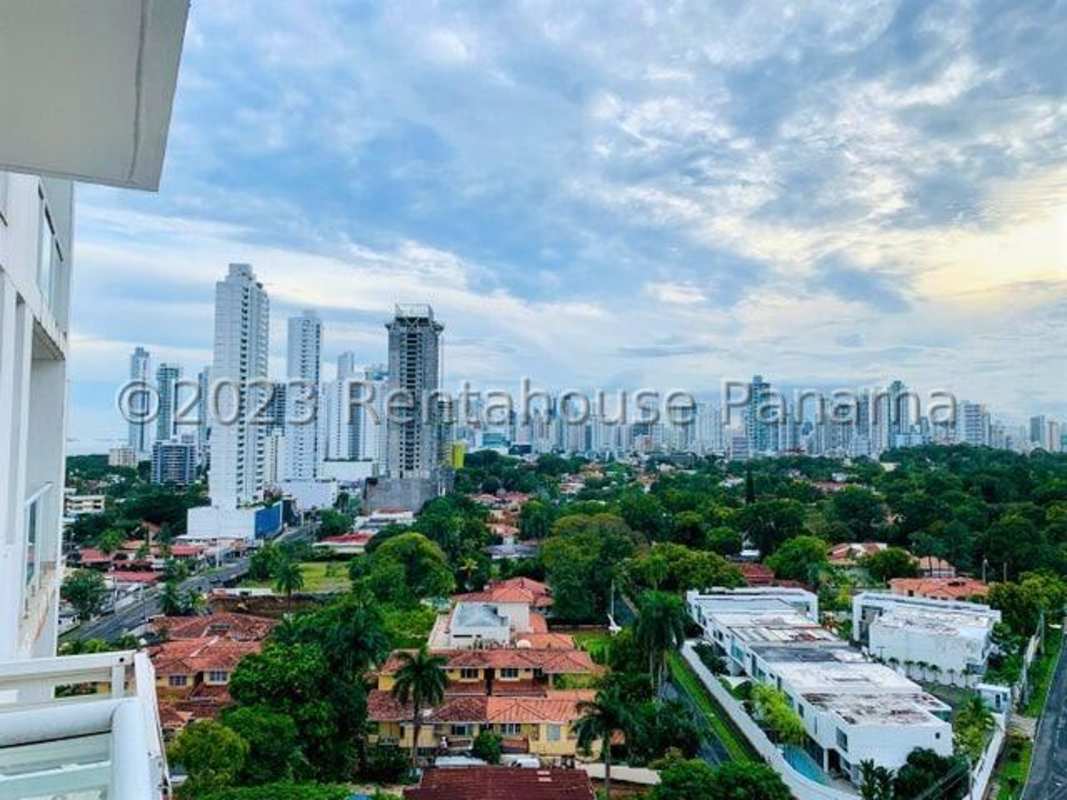 Kitchen space with cabinetry, stove and microwave in PH Coco del Mar Panama City oceanfront condo