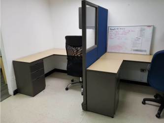Partitioned cubicles with blue and gray panels chairs in PH Milano Office Panama