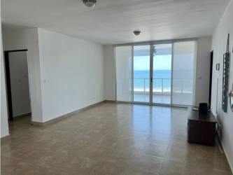Living room with glass doors and ocean view Playa Blanca Panama apartment