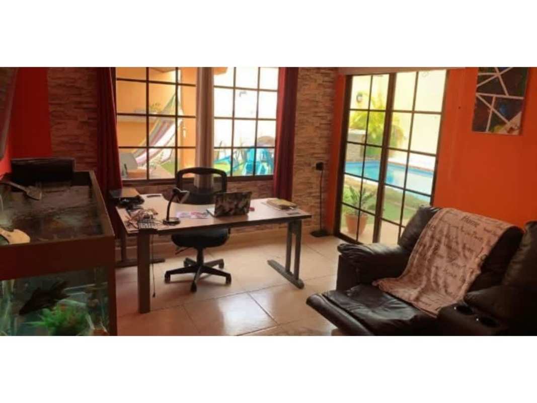 Office desk area with glass doors to terrace in house for sale Panama City