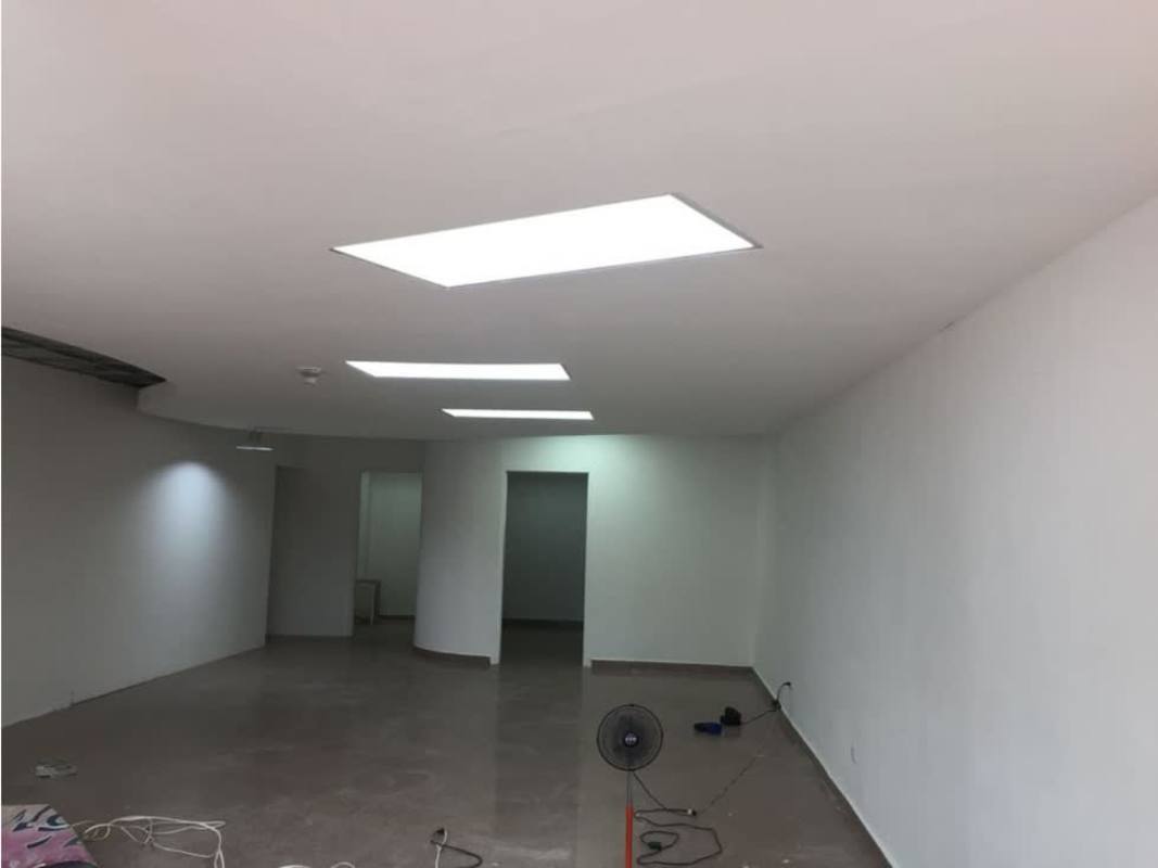 Open commercial space with tiled floor, white walls and lighting in PH Kitaen Plaza Panama City