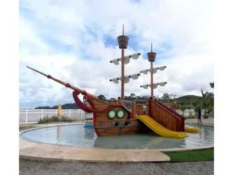 Colorful pirate ship water playground and splash pool for children at Playa Dorada beach club Panama