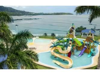 Colorful pirate-themed splash pool with slides at Playa Dorada beach club community Panama