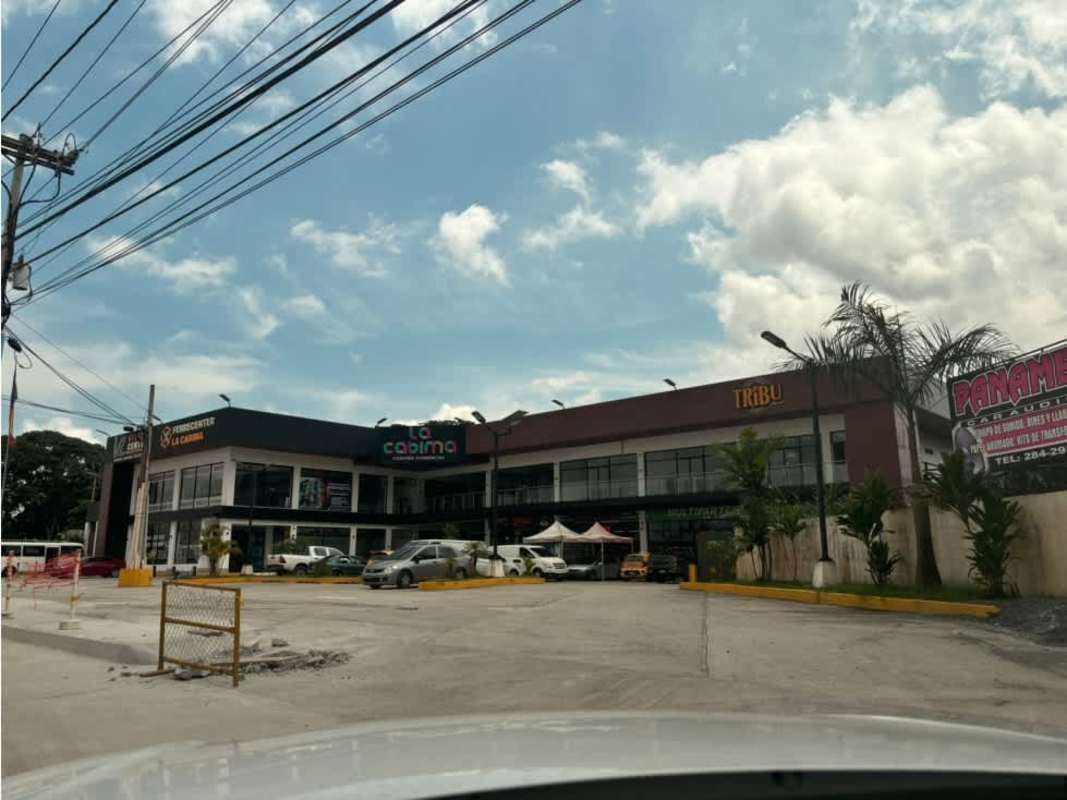 Open plan commercial interior with tile flooring and raw ceilings Plaza La Cabima Panama