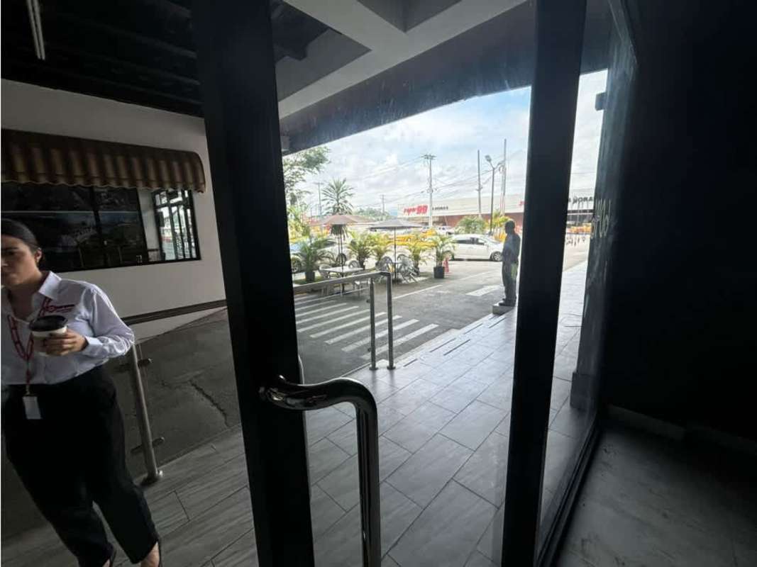Interior entrance area with glass doors at Plaza La Cabima commercial space Panama