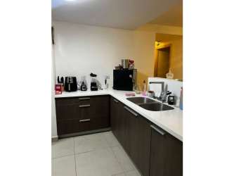 Modern open living dining area with tile floor and large windows at PH Scala Panama