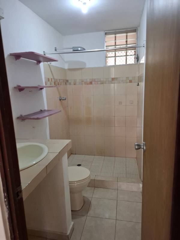 Tiled living room with large window and open doorway PH Cantabria Las Acacias Panama