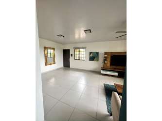 Spacious bedroom with tiled flooring and large window Penonomé house