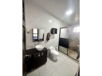 Modern living room with neutral decor, big window and entertainment center in Llano Hermoso