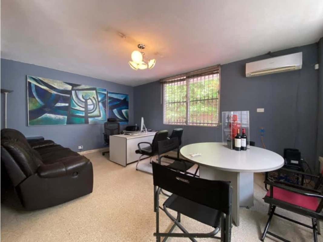 Spacious office with meeting table, desks, and large windows in San Francisco Panama