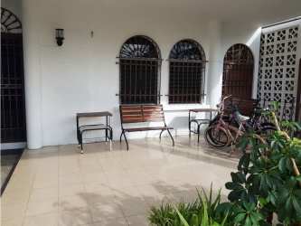 Kitchen with wooden cabinetry and ceramic tile in commercial residential house El Ingenio Panama City