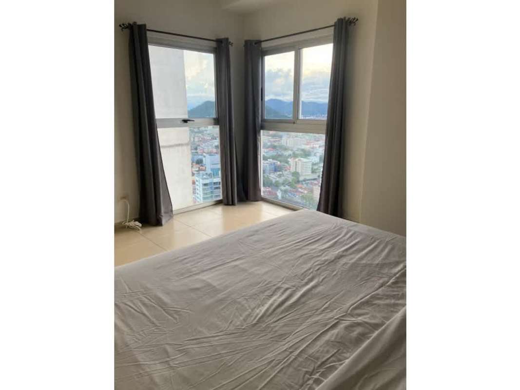 Corner bedroom with large panoramic windows city and mountain view PH White Panama