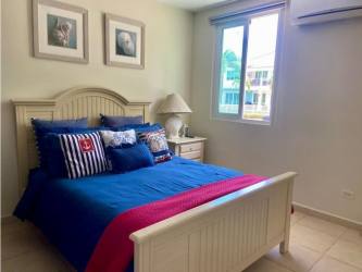 Furnished balcony overlooking golf course in Bijao Beach Residences Panama apartment for sale