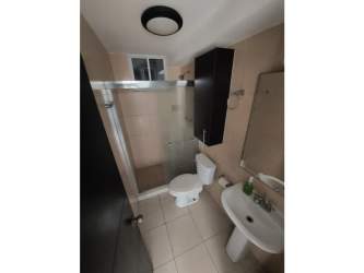 Bathroom with ceramic sink, glass enclosed shower, mirror in PH Vista Marina Panama