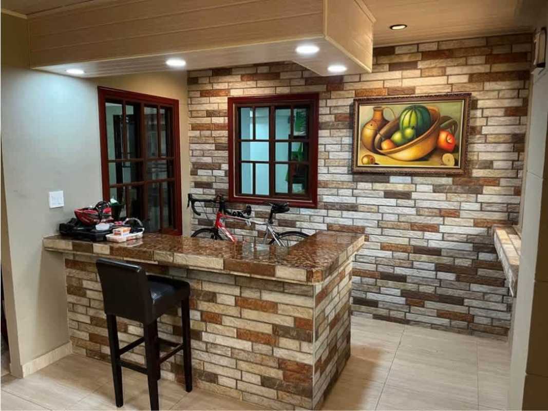 Indoor bar area with stone accent wall and granite top Paseo Miramar La Chorrera