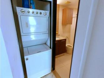 Contemporary kitchen with granite countertop, stainless appliances, tile backsplash in Playa Blanca Resort condo Panama