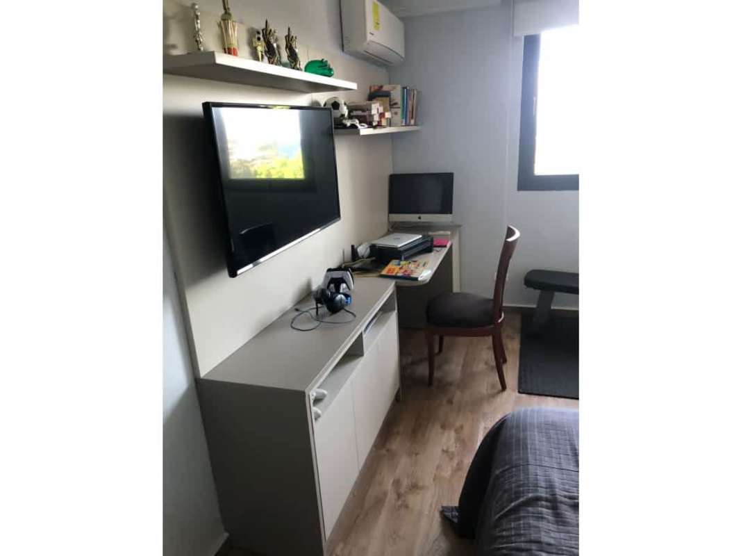 Bedroom space inside PH Aranjuez apartment featuring large window, closet, air conditioning in El Cangrejo Panama