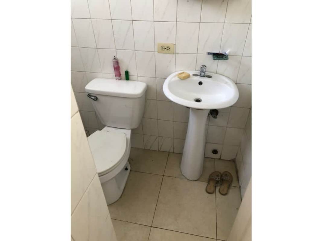 Kitchen space with granite countertops and wood cabinetry in PH Aranjuez Panama City