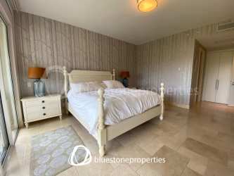 Large bright bedroom with ensuite bathroom and closet at Buenaventura golf condo Panama