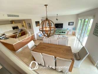 Integrated kitchen dining and living area in luxury golf condo Buenaventura Panama