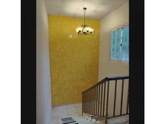 Bright living and dining area opening onto terrace in mountain property in Cerro Azul