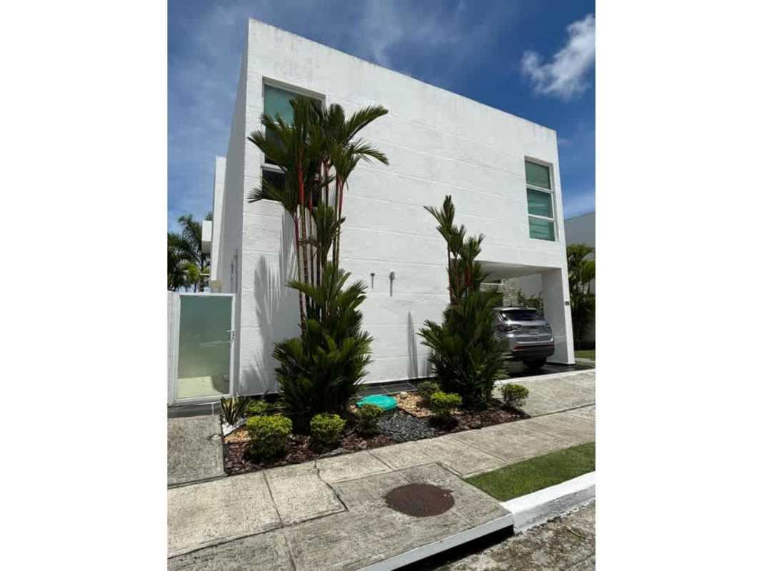 Living room with large windows, double-height ceiling, furnished in Costa Sur Costa Esmeralda home