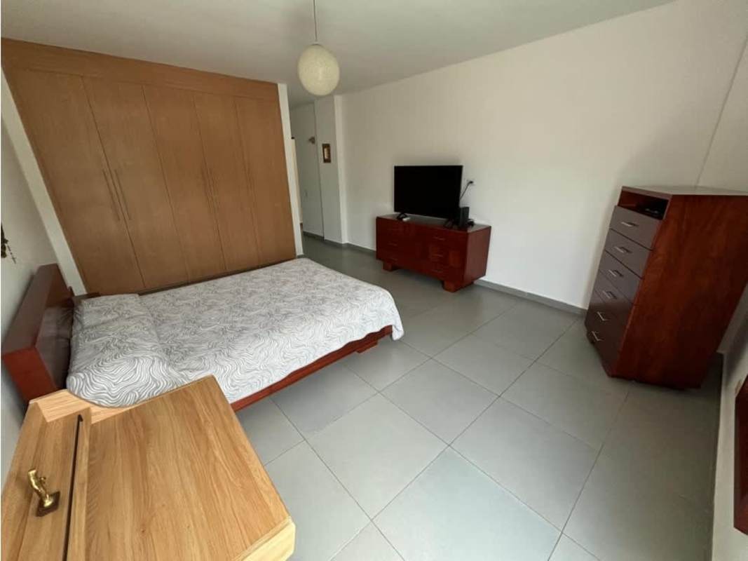 Modern open kitchen with granite island and black cabinetry Costa Esmeralda Panama