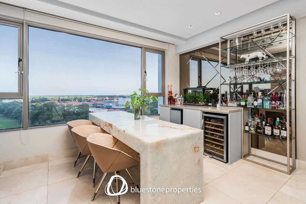 Elegant home bar marble countertops mirrored backsplash Santa María Golf Panama