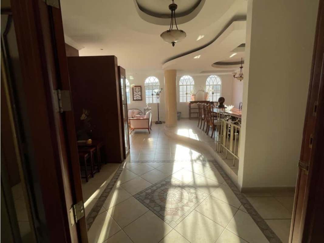 Bright spacious living room with arched windows, marble columns in PH Quentino Panama City