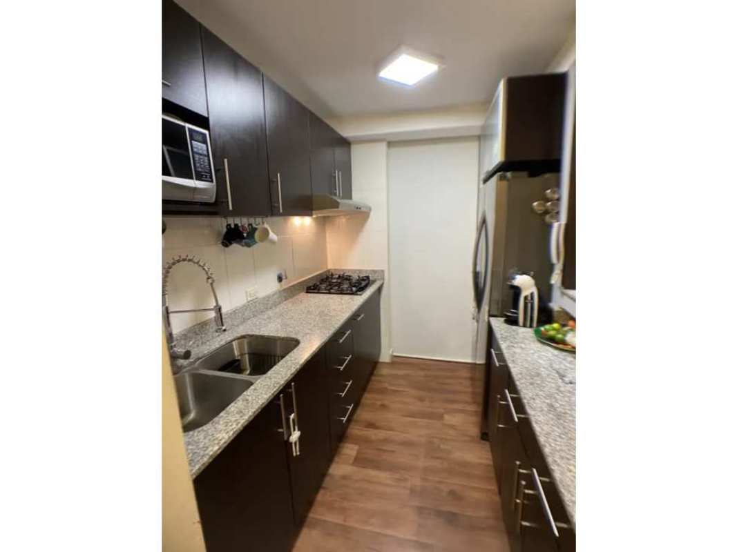 Modern double-height lobby entrance at PH Arenas Park with seating and access control