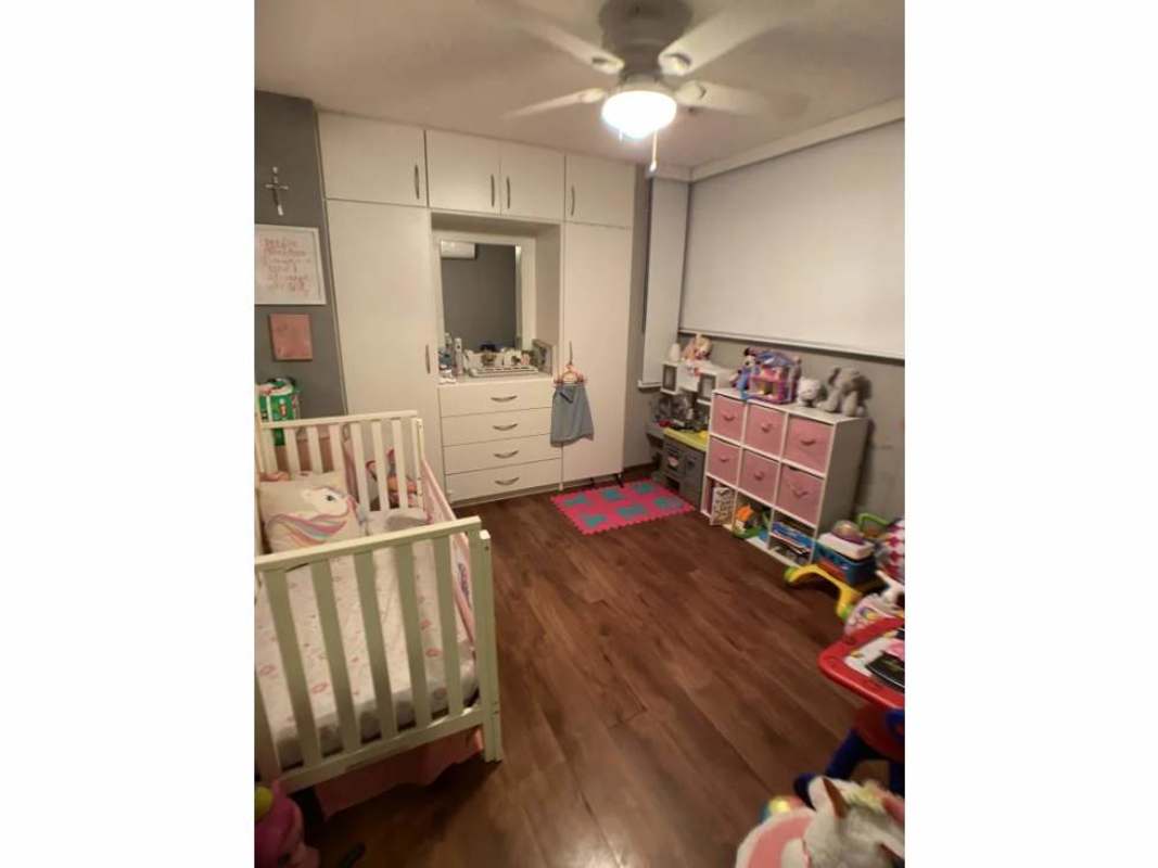 Master bedroom night city view with floor-to-ceiling glass PH Arenas Park Panama