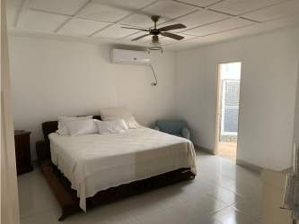 Large covered terrace with BBQ gazebo and garden view in Coronado 4BR beach house Panama