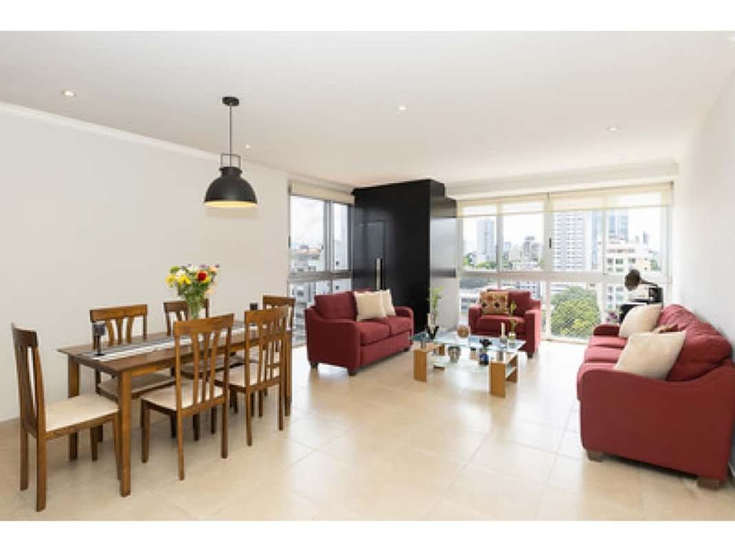 Modern dining space with large windows and city view PH Fairmont Plaza Panama City