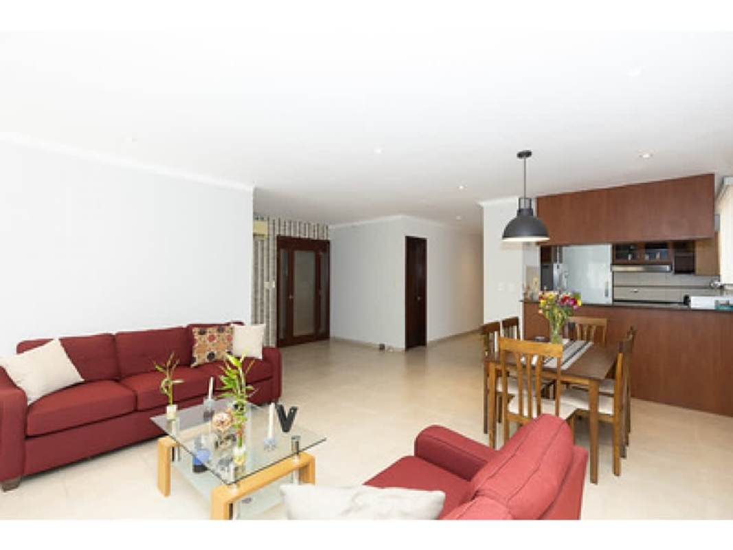 Spacious open area red sofas glass coffee table PH Fairmont Plaza Panama City