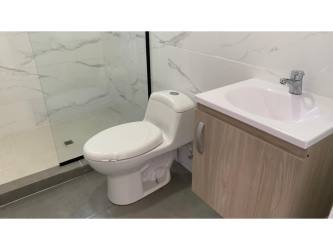 Modern bathroom marble tile glass shower enclosure San Carlos Panama