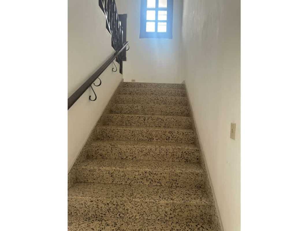 Spacious living room with tiled floors and large windows luxury house Altos del Golf Panama City for rent