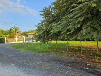 Entrance to fenced corner lot for sale in Coronado Panama beach area