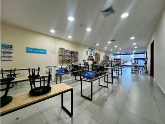 Open classroom or shop space with display shelves and large windows Midtown Plaza Panama City